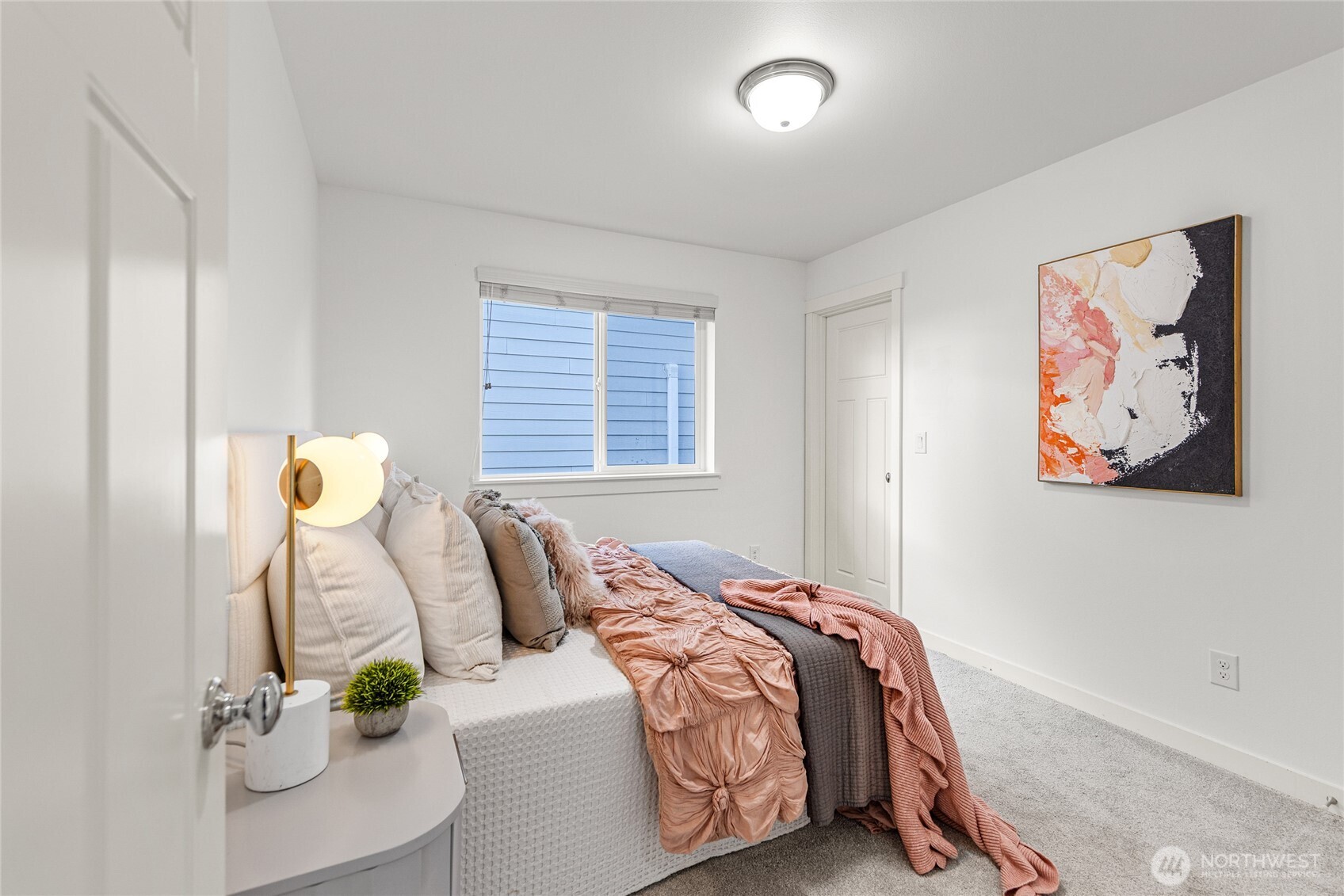 4115 176th Place Southeast Bothell, WA 98012 - Photo 28 of 35 a bedroom with a bed and a painting on the wall