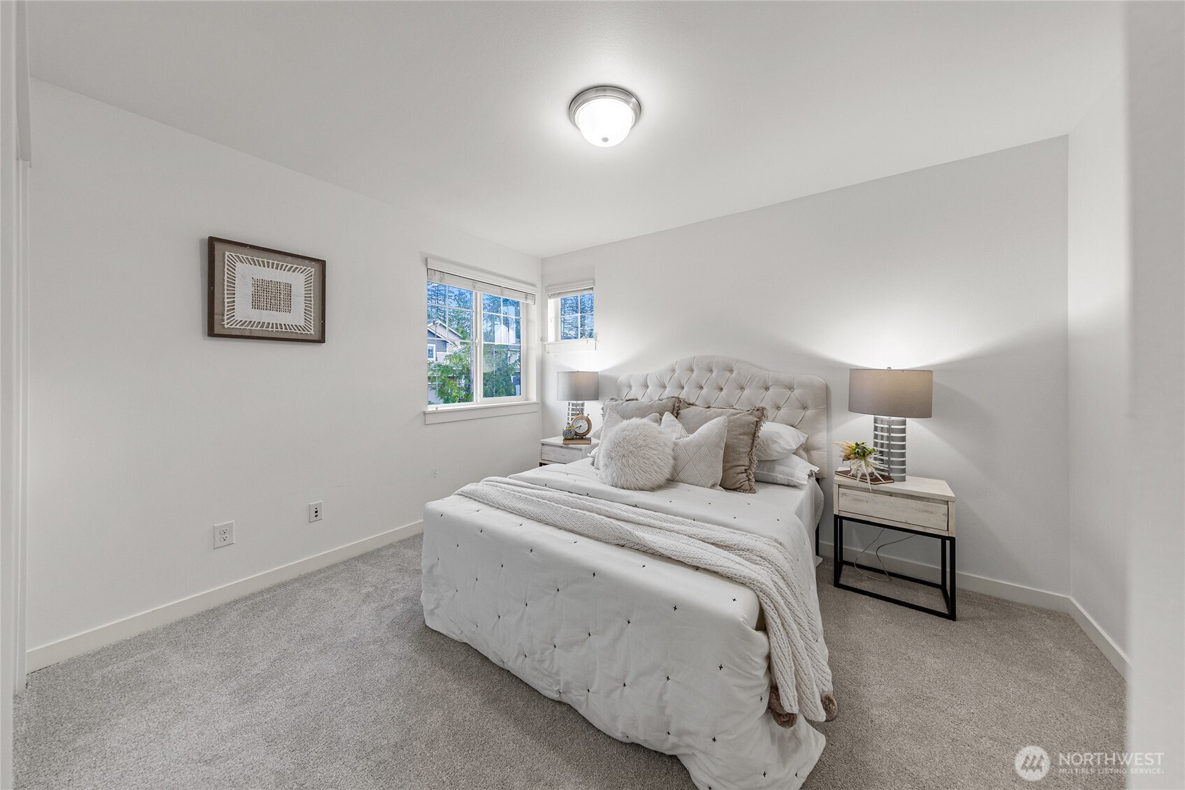 4115 176th Place Southeast Bothell, WA 98012 - Photo 31 of 35 a bedroom with a bed and a lamp on the dresser