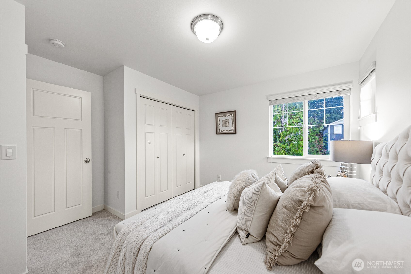 4115 176th Place Southeast Bothell, WA 98012 - Photo 32 of 35 a bed room with a bed and a large window