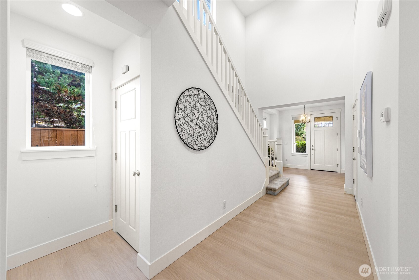 4115 176th Place Southeast Bothell, WA 98012 - Photo 4 of 35 a view of a hallway with windows and entryway