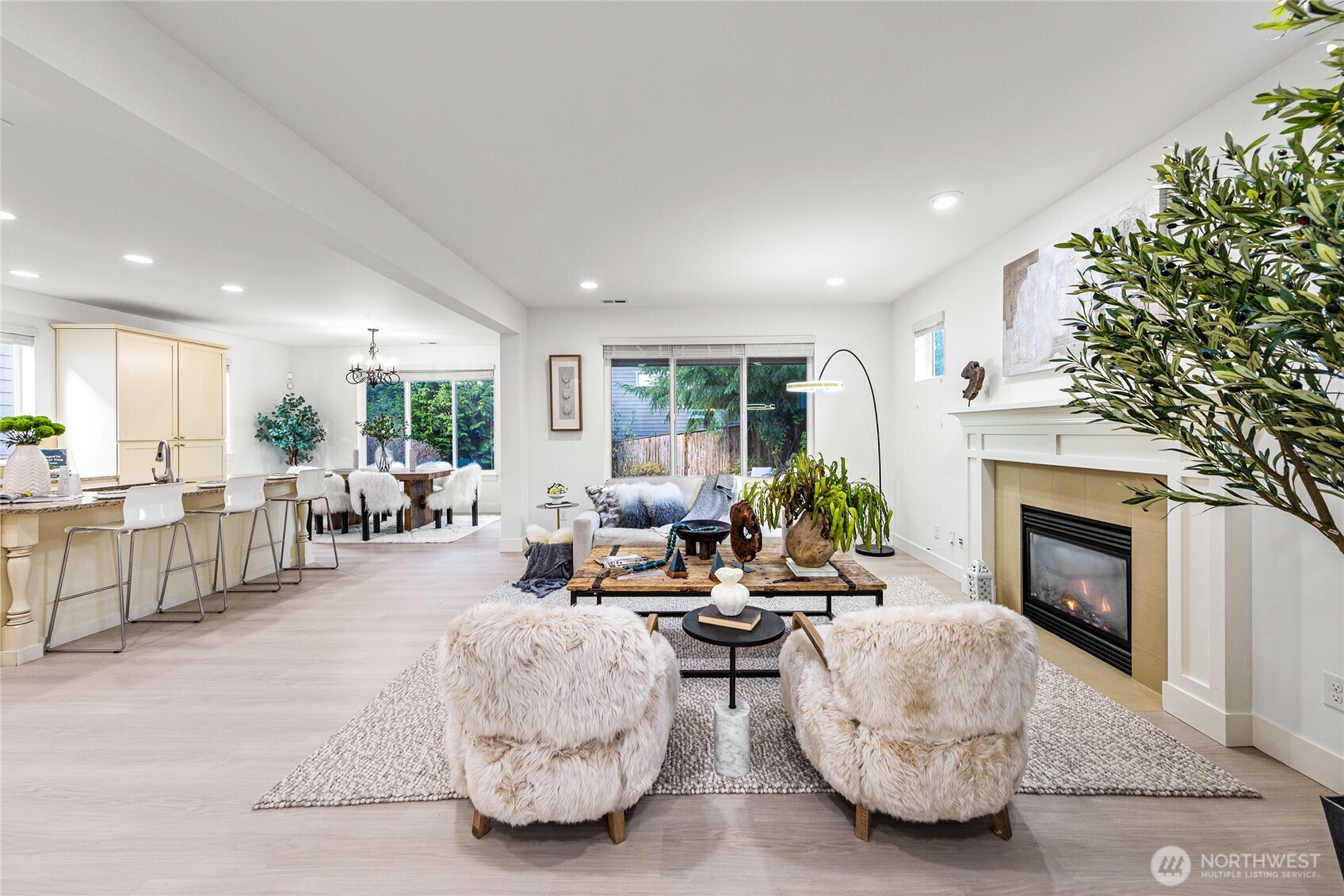 4115 176th Place Southeast Bothell, WA 98012 - Photo 5 of 35 a living room with furniture a fireplace and a table