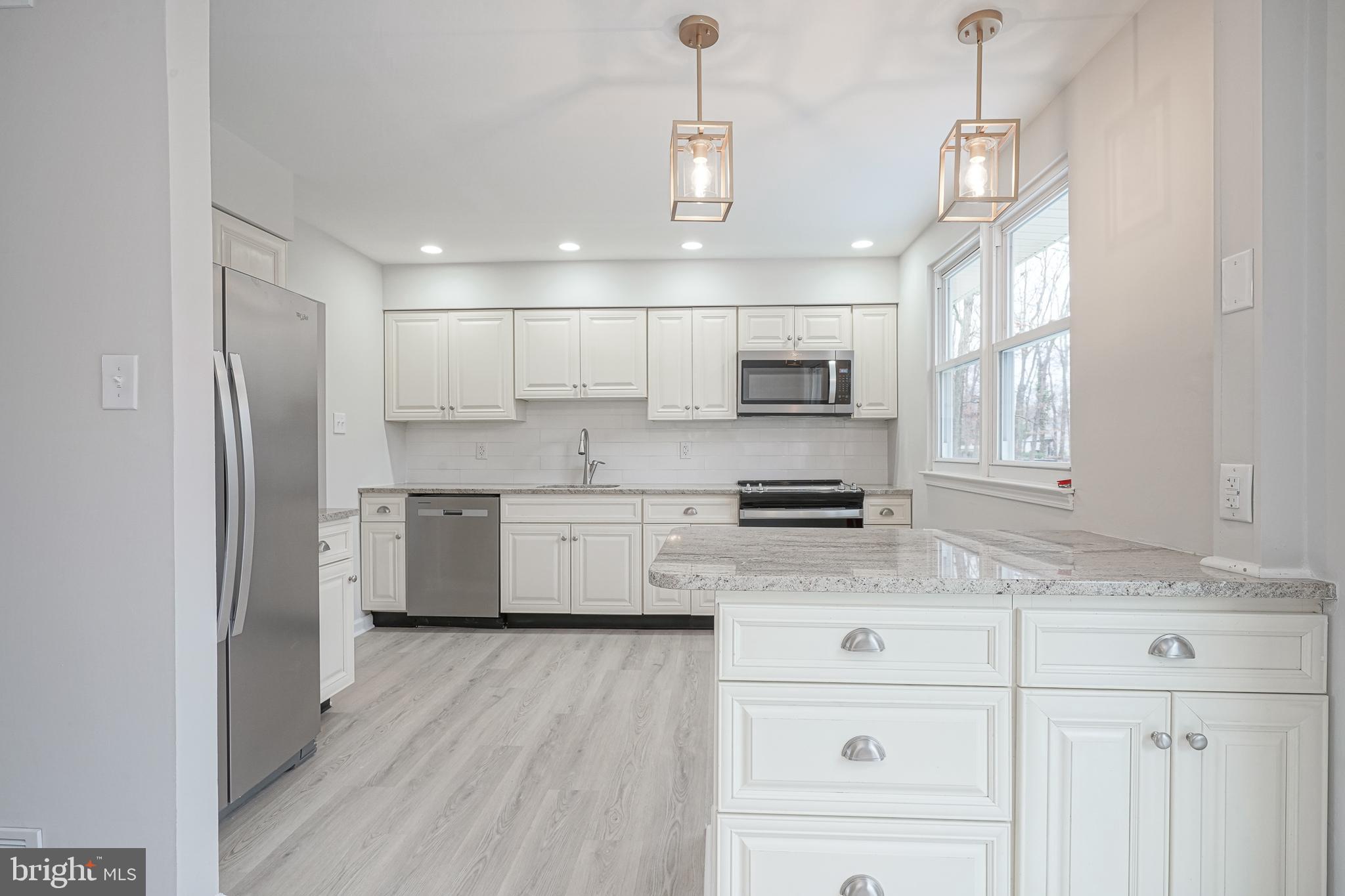 3 Alberts Avenue Sicklerville, NJ 08081 - Photo 11 of 36 a kitchen with stainless steel appliances a refrigerator sink and microwave