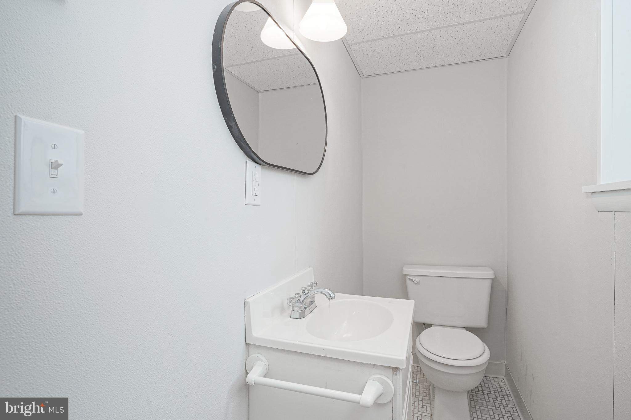 3 Alberts Avenue Sicklerville, NJ 08081 - Photo 26 of 36 a white toilet sitting next to a bathroom sink