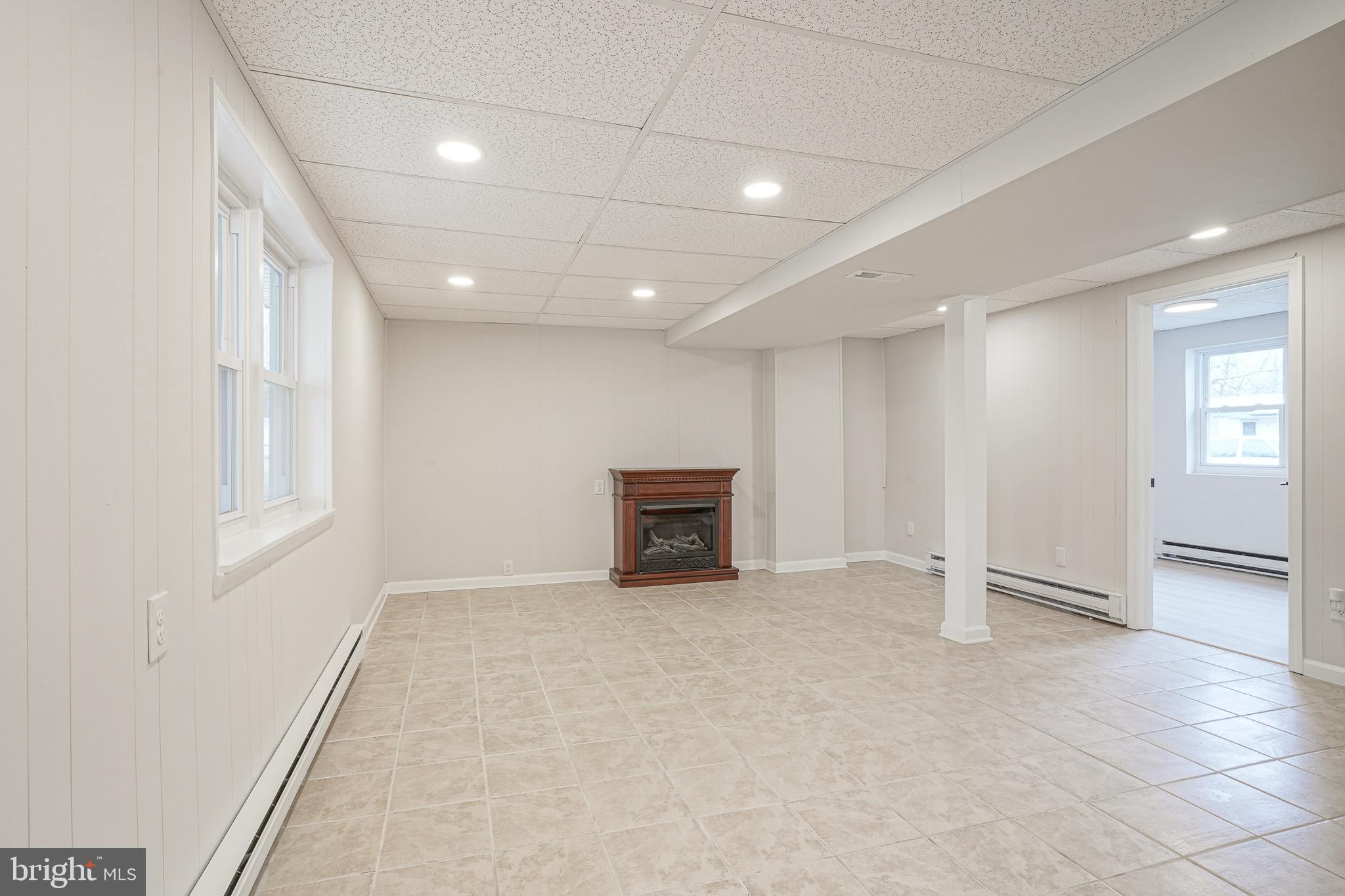 3 Alberts Avenue Sicklerville, NJ 08081 - Photo 29 of 36 an empty room with windows and fireplace