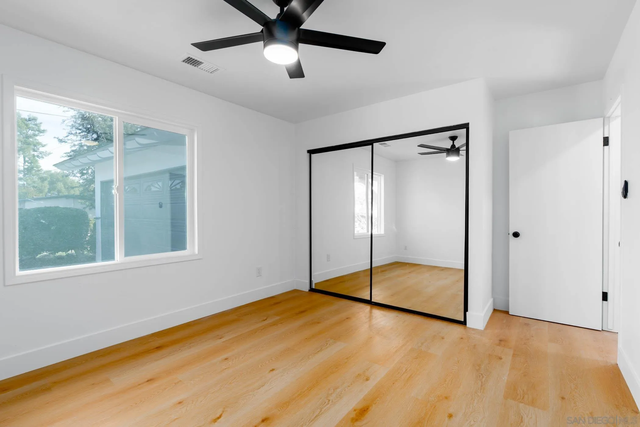 12918 Seiler Street Poway, CA 92064 - Photo 14 of 25 a view of an empty room with glass door
