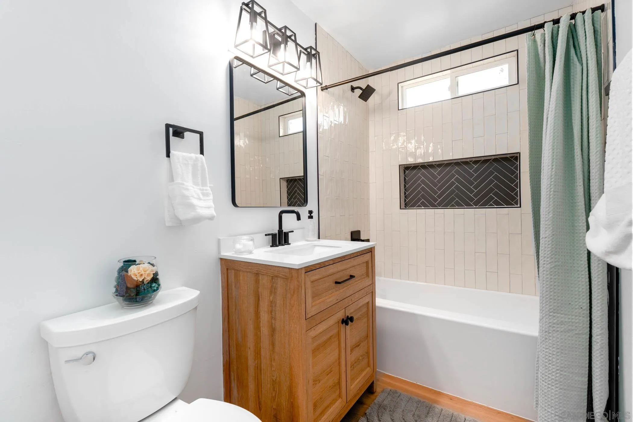 12918 Seiler Street Poway, CA 92064 - Photo 16 of 25 a bathroom with a sink a toilet and shower