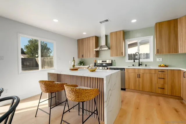 a kitchen with counter top space cabinets and appliances