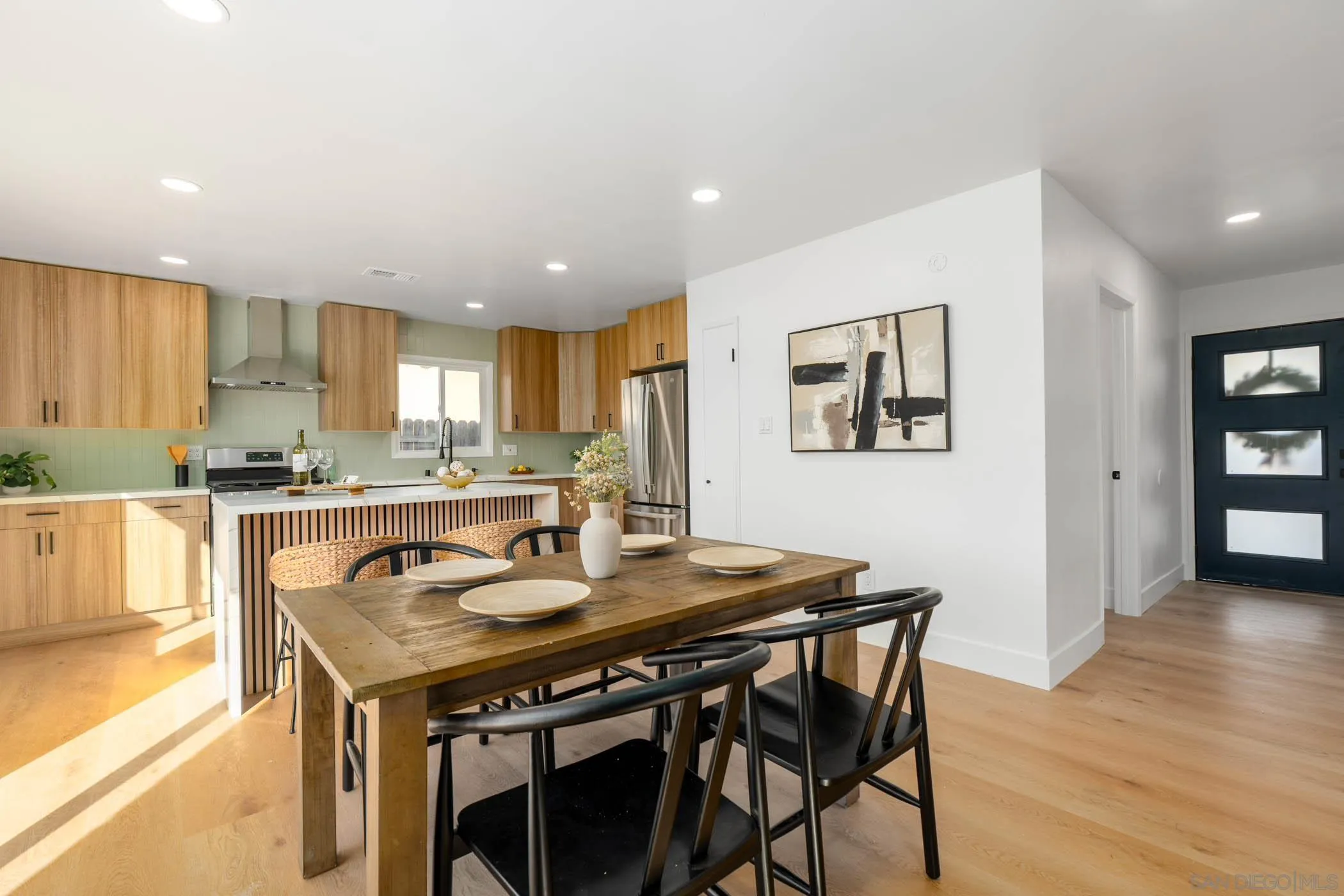 12918 Seiler Street Poway, CA 92064 - Photo 10 of 25 a view of a dining room with furniture and wooden floor