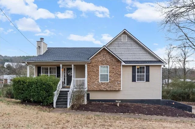 a front view of a house with a yard