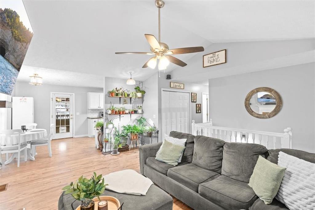 93 4th Street Emerson, GA 30137 - Photo 12 of 46 a living room with furniture a window and a chandelier