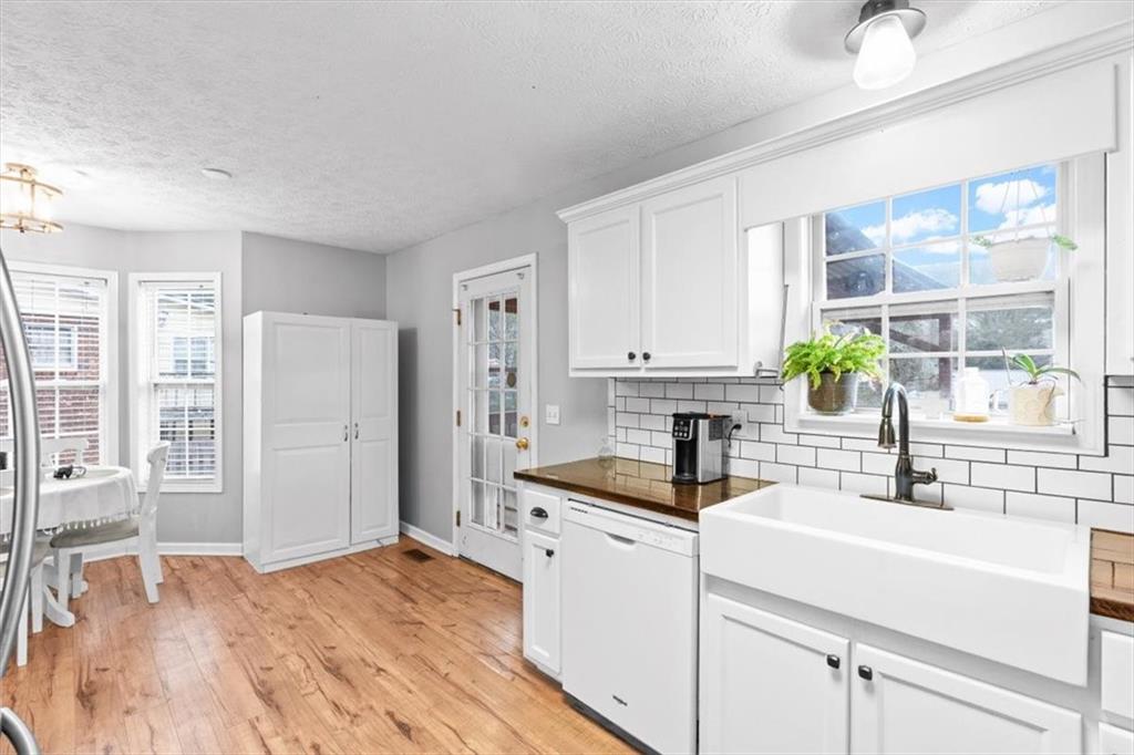 93 4th Street Emerson, GA 30137 - Photo 16 of 46 a kitchen with a sink and a refrigerator