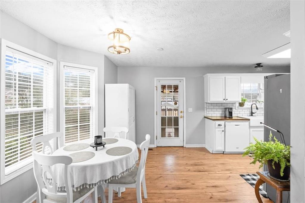 93 4th Street Emerson, GA 30137 - Photo 17 of 46 a very nice looking dining room with kitchen island granite countertop furniture and a window