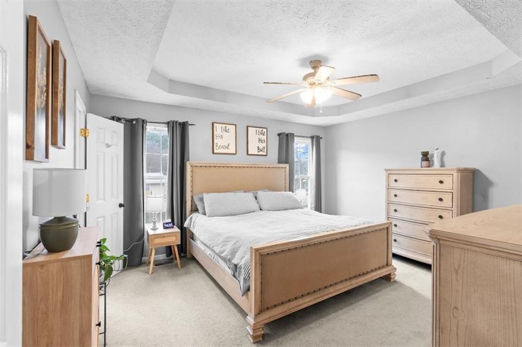 93 4th Street Emerson, GA 30137 - Photo 19 of 46 a bedroom with a bed and a chandelier