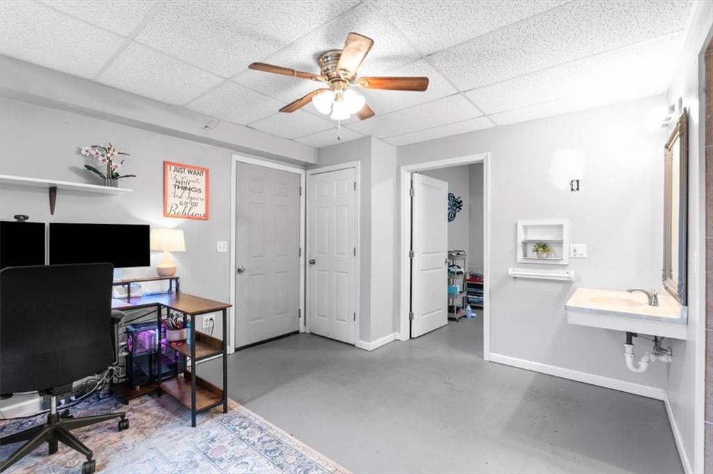 93 4th Street Emerson, GA 30137 - Photo 28 of 46 a view of a workspace with furniture and a ceiling fan