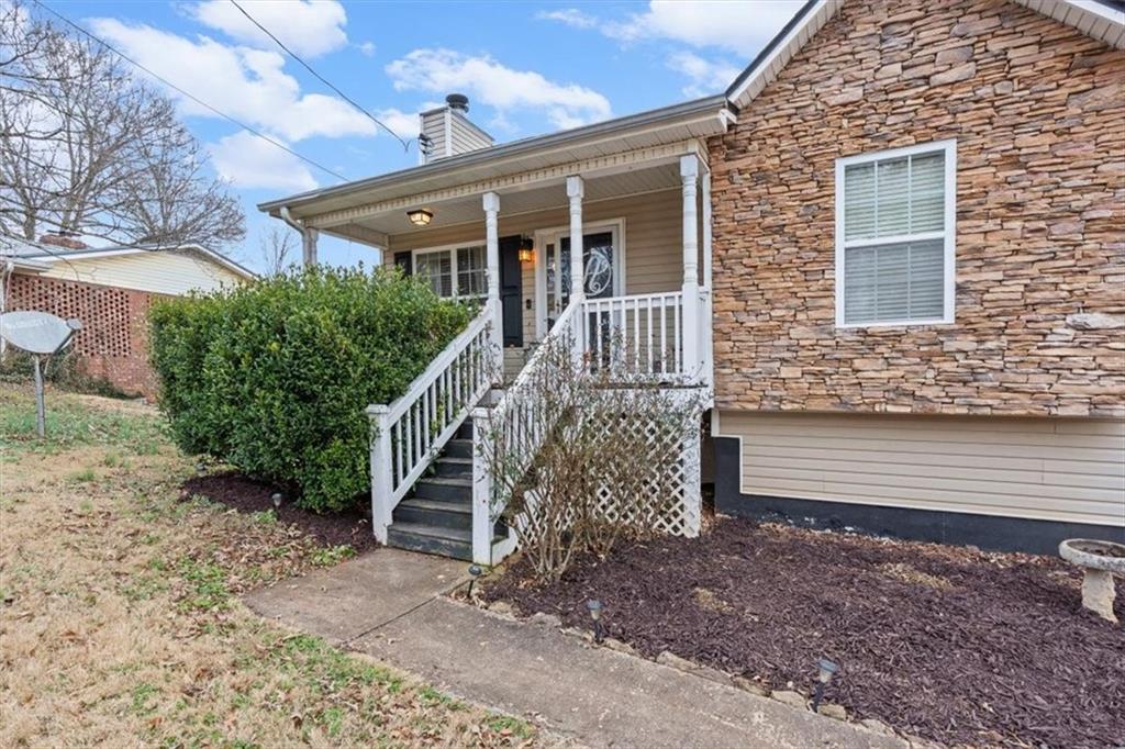93 4th Street Emerson, GA 30137 - Photo 5 of 46 a front view of a house with stairs