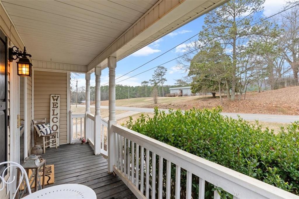 93 4th Street Emerson, GA 30137 - Photo 6 of 46 a view of a porch with furniture and garden