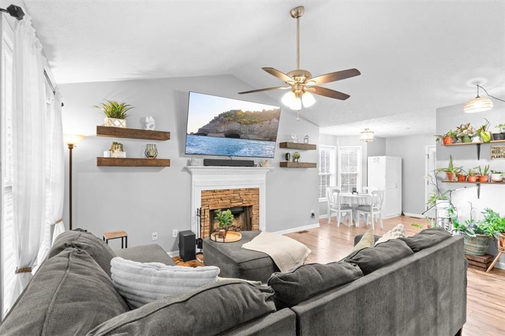 93 4th Street Emerson, GA 30137 - Photo 8 of 46 a living room with furniture a chandelier and a window