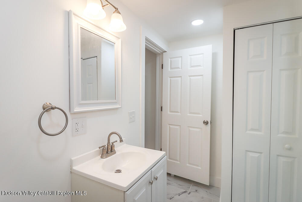 68 Orinsekwa Road Valatie, NY 12184 - Photo 11 of 41 a bathroom with a sink and a mirror