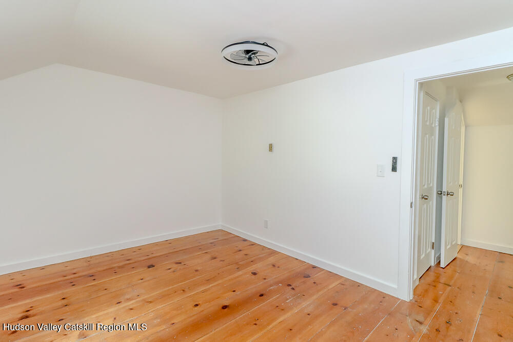 68 Orinsekwa Road Valatie, NY 12184 - Photo 20 of 41 a view of a room with wooden floor and closet