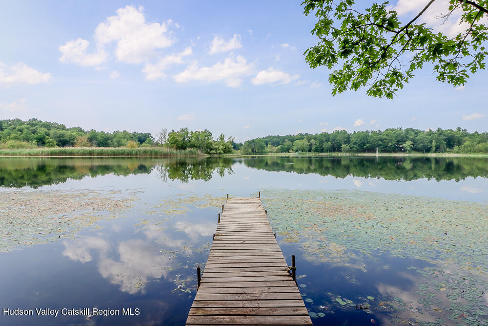 68 Orinsekwa Road Valatie, NY 12184 - Photo 2 of 41 a view of a lake with a large trees