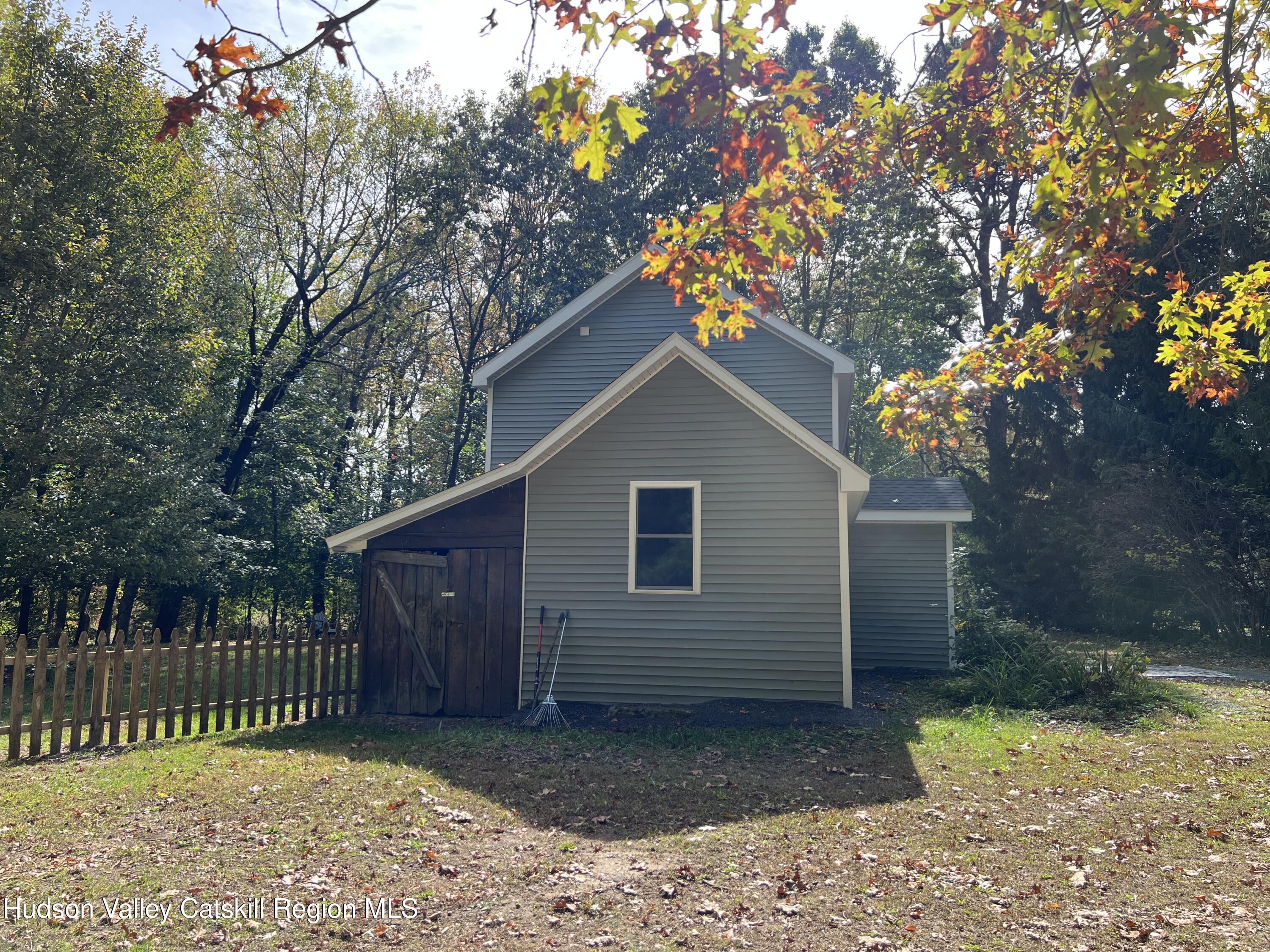 68 Orinsekwa Road Valatie, NY 12184 - Photo 33 of 41 a house with a tree in the background