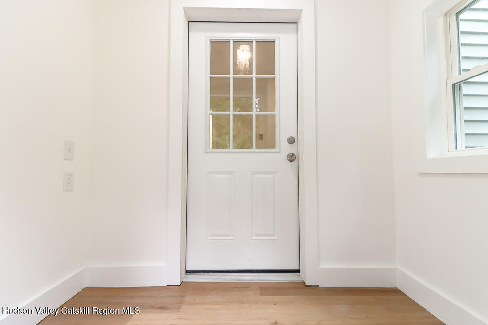 68 Orinsekwa Road Valatie, NY 12184 - Photo 5 of 41 a view of a small space with wooden floor and a window