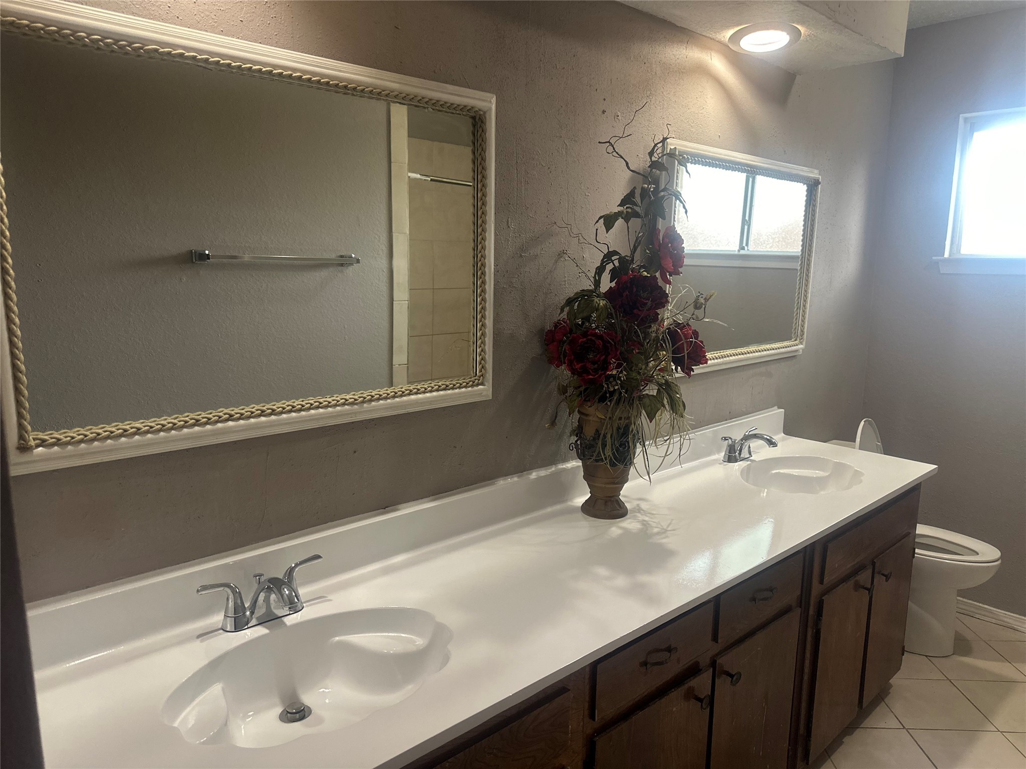 4202 Ponca Street Pasadena, TX 77504 - Photo 12 of 15 a bathroom with a sink and a mirror