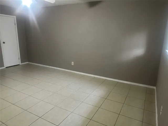 a bath tub sitting next to a white sink and vanity