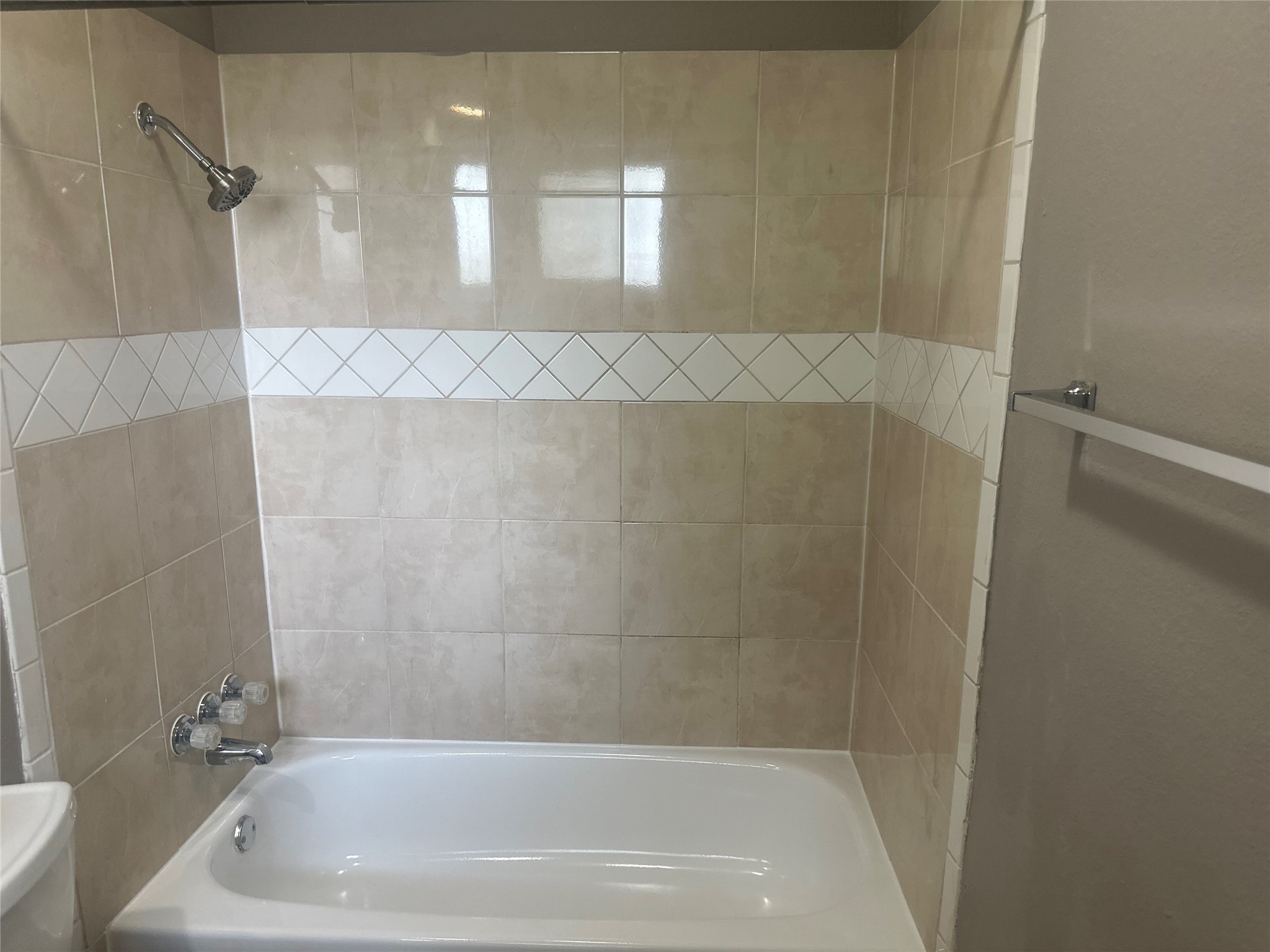 4202 Ponca Street Pasadena, TX 77504 - Photo 14 of 15 a bath tub sitting next to a white sink and vanity