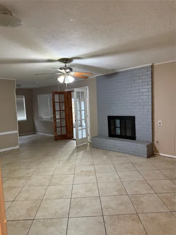 a kitchen with granite countertop a sink and a stove top oven