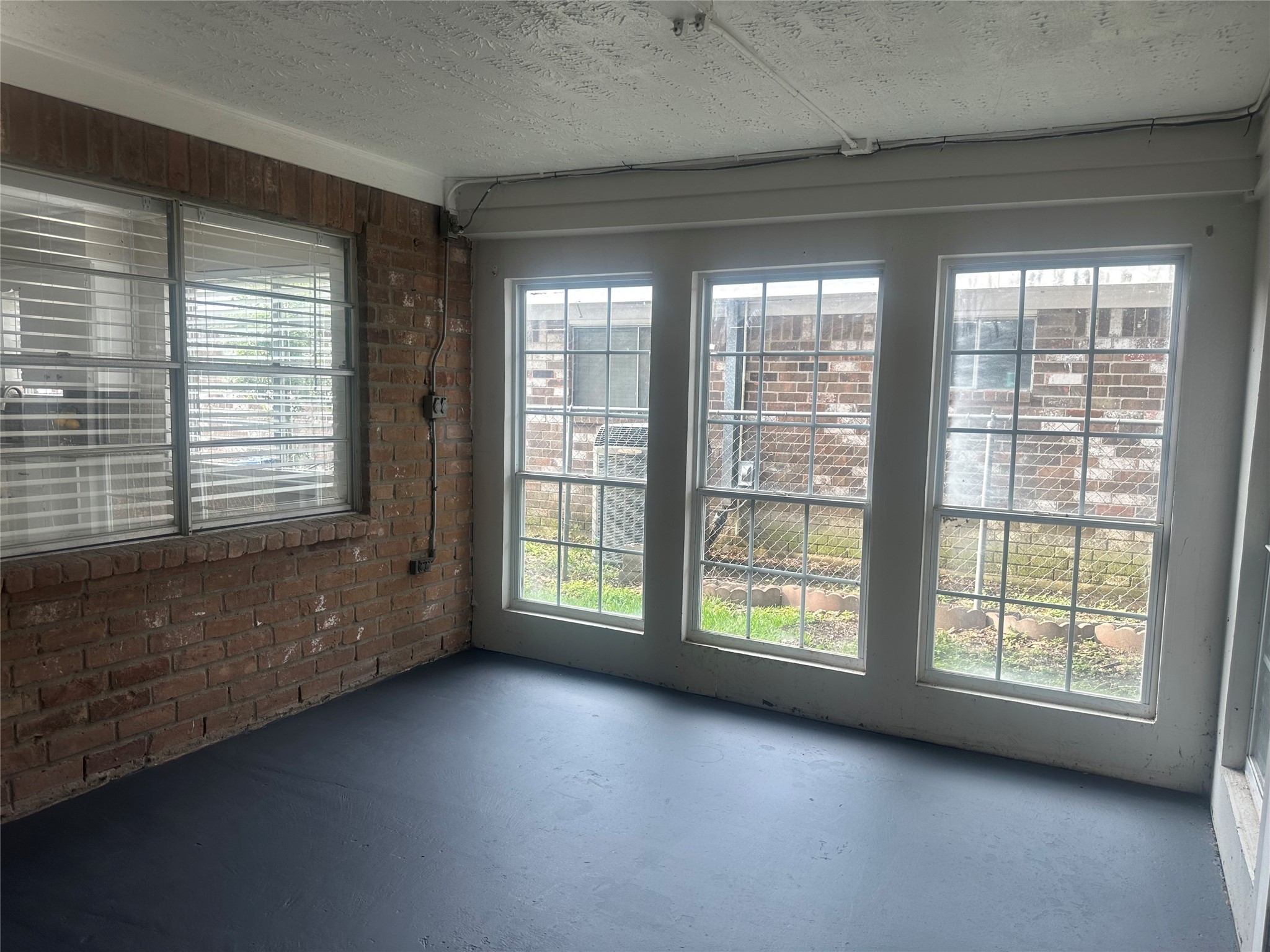 4202 Ponca Street Pasadena, TX 77504 - Photo 7 of 15 a view of an empty room with a window