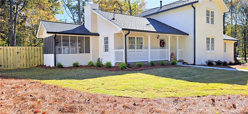 2826 Whippoorwill Circle Northwest Duluth, GA 30097 - Photo 1 of 24 a front view of a house with a yard and garage