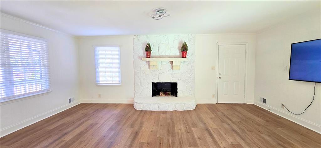 2826 Whippoorwill Circle Northwest Duluth, GA 30097 - Photo 12 of 24 a view of a room with wooden floor and windows