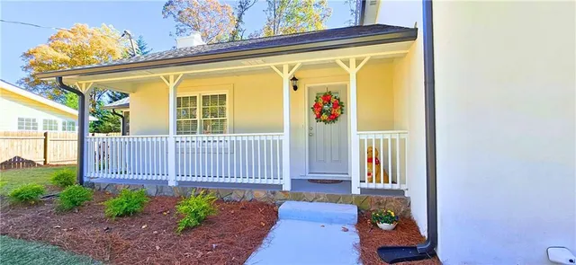 a view of a porch with furniture