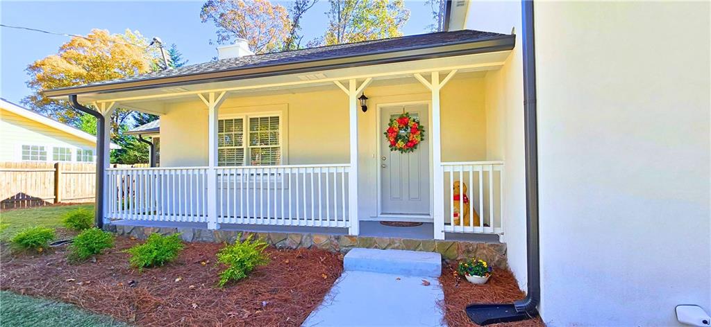 2826 Whippoorwill Circle Northwest Duluth, GA 30097 - Photo 2 of 24 a view of a porch with furniture