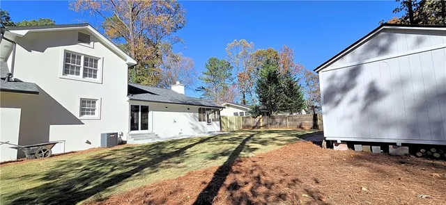 a house with trees in the background