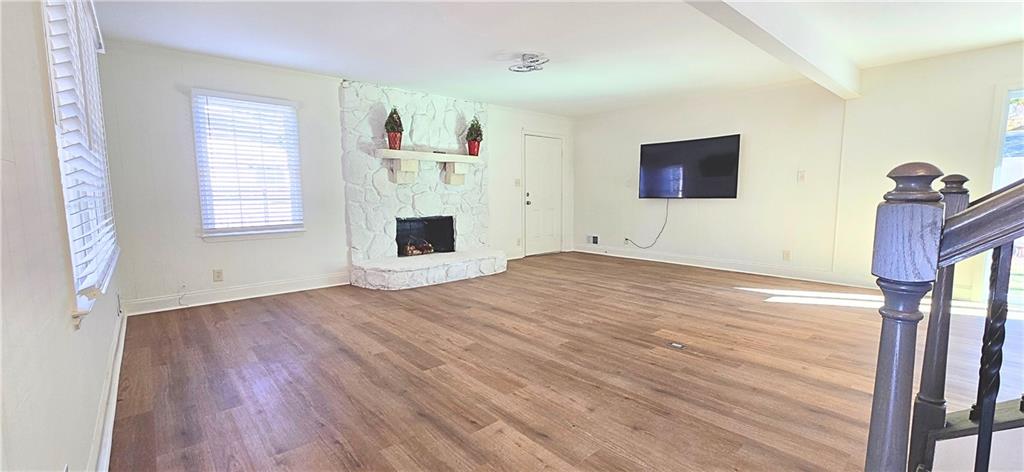 2826 Whippoorwill Circle Northwest Duluth, GA 30097 - Photo 6 of 24 a view of empty room with wooden floor and fan