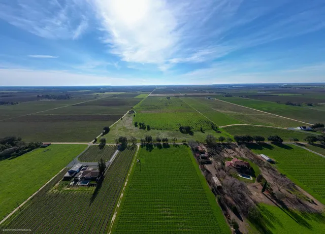 a view of a golf course with a lake view