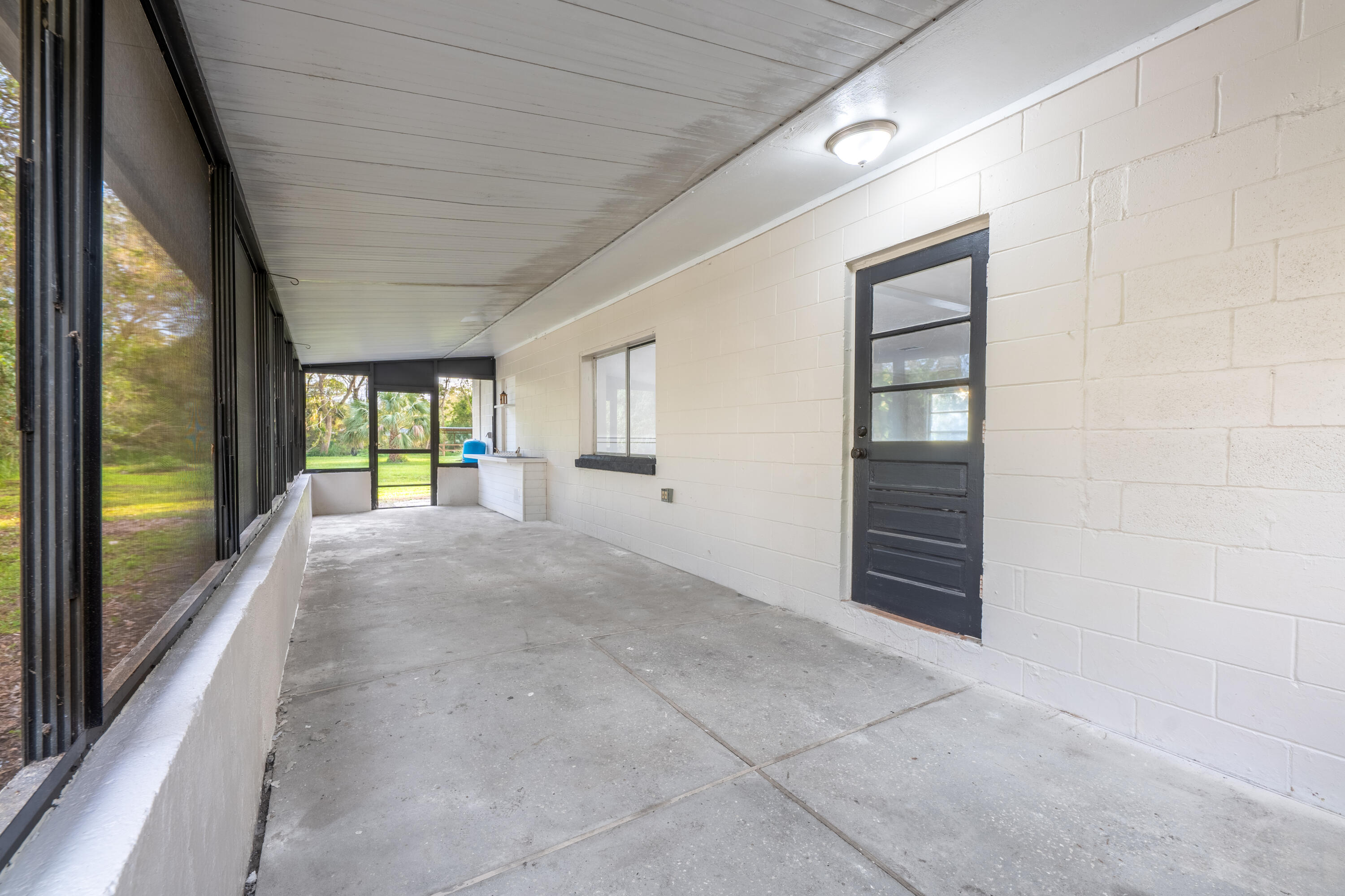 2910 McNeil Road Fort Pierce, FL 34981 - Photo 17 of 21 Back Screen Patio 2