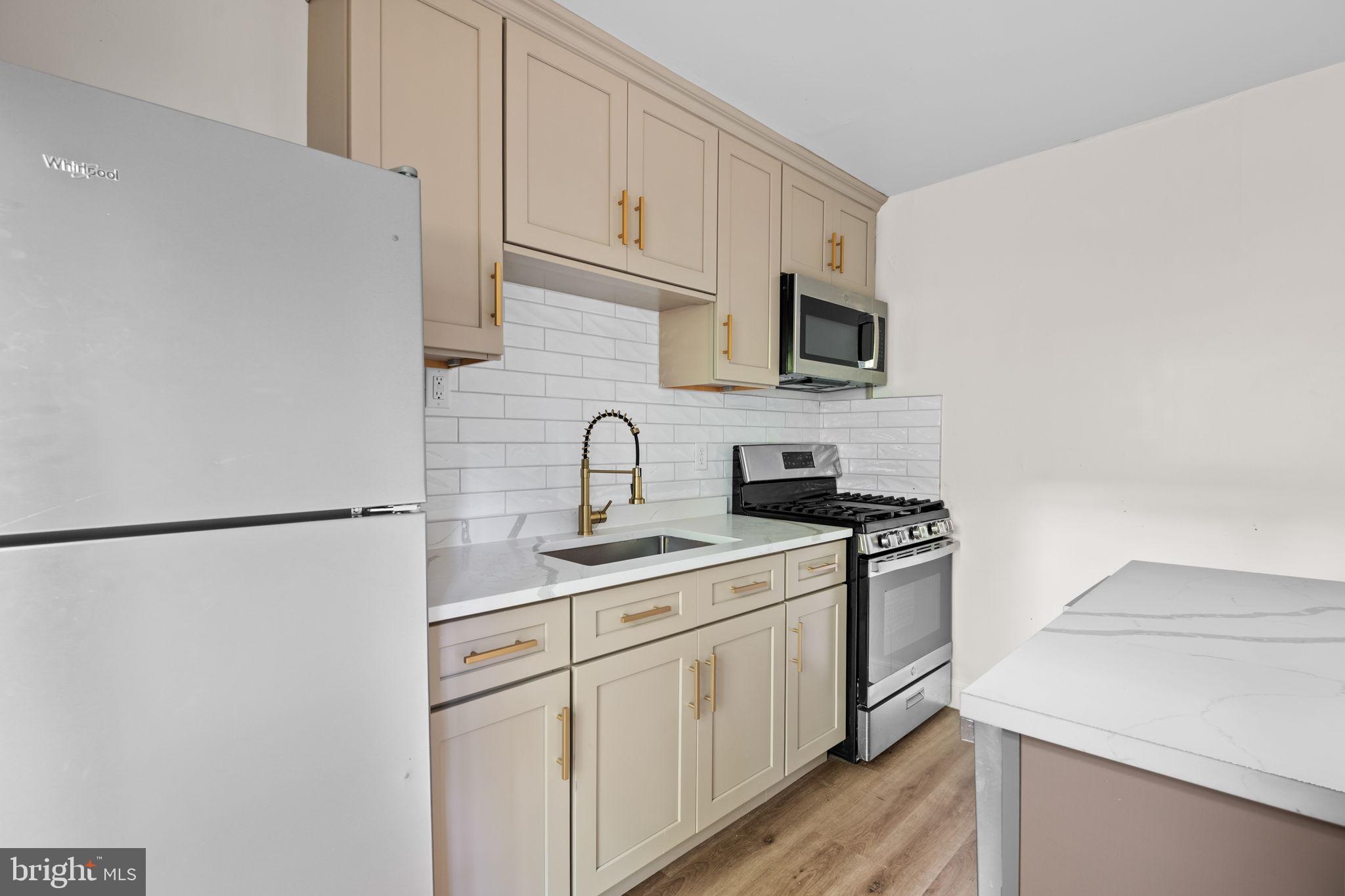 322 South Poppleton Street Baltimore, MD 21230 - Photo 10 of 34 Modern kitchen with sleek finishes.