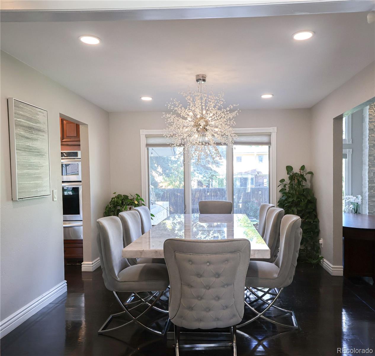 5661 West Lakeridge Road Denver, CO 80227 - Photo 11 of 48 a view of a dining room with furniture window and outside view