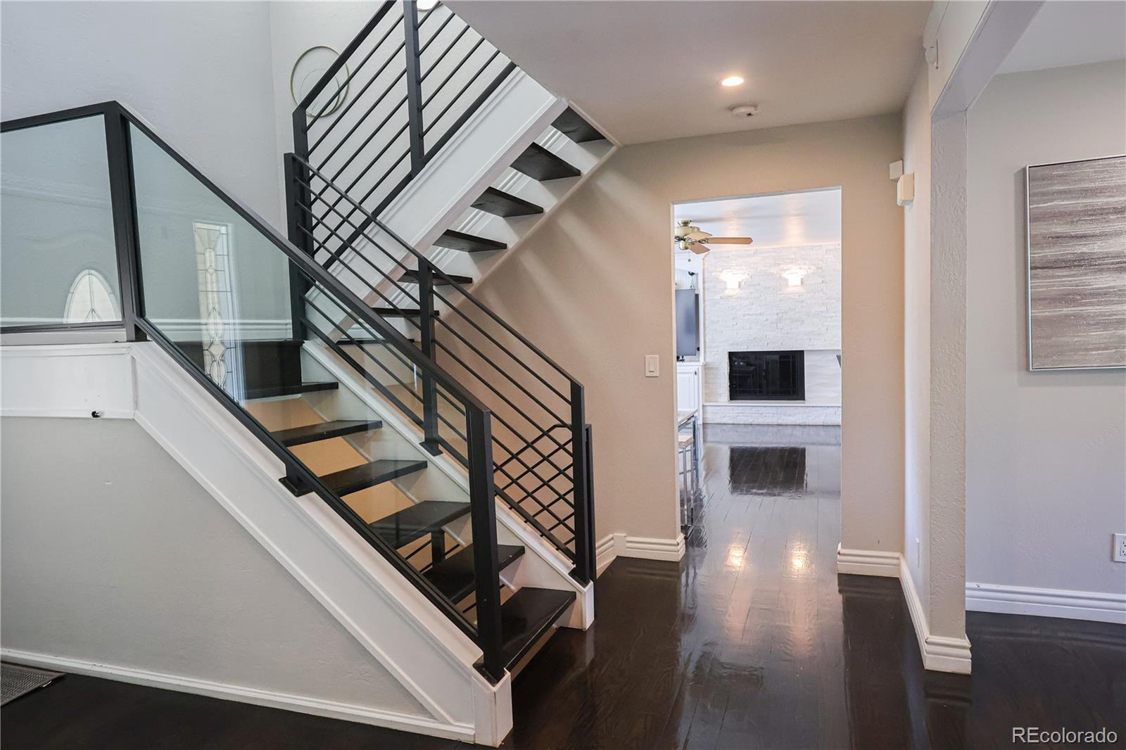 5661 West Lakeridge Road Denver, CO 80227 - Photo 14 of 48 a view of entryway and hall with wooden floor