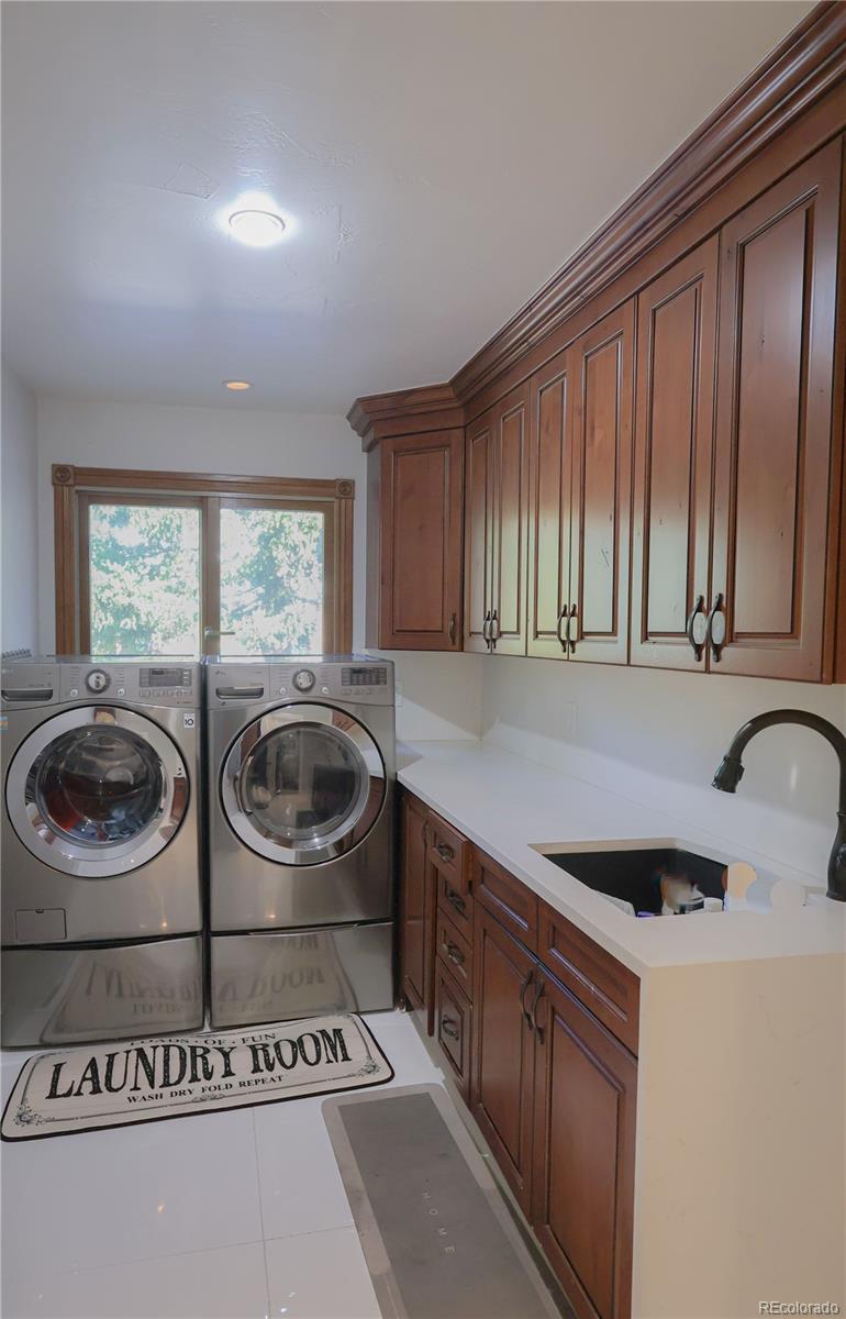 5661 West Lakeridge Road Denver, CO 80227 - Photo 15 of 48 a kitchen with a stove a sink and a microwave
