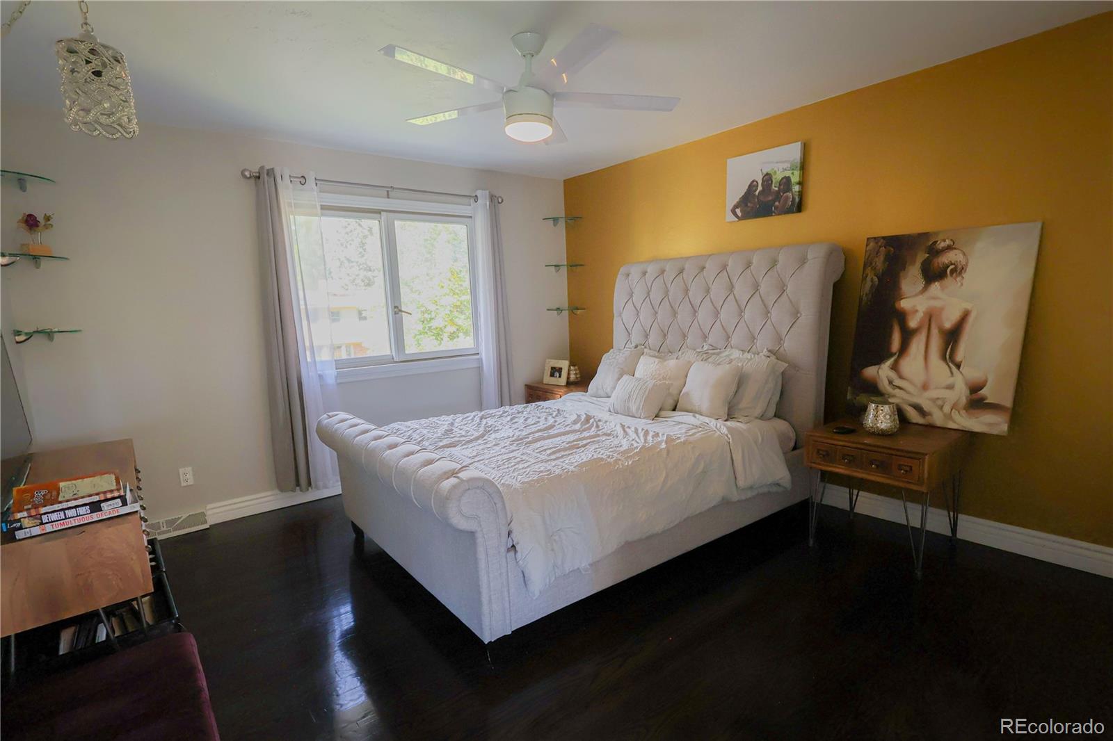 5661 West Lakeridge Road Denver, CO 80227 - Photo 21 of 48 a bedroom with a bed and a window