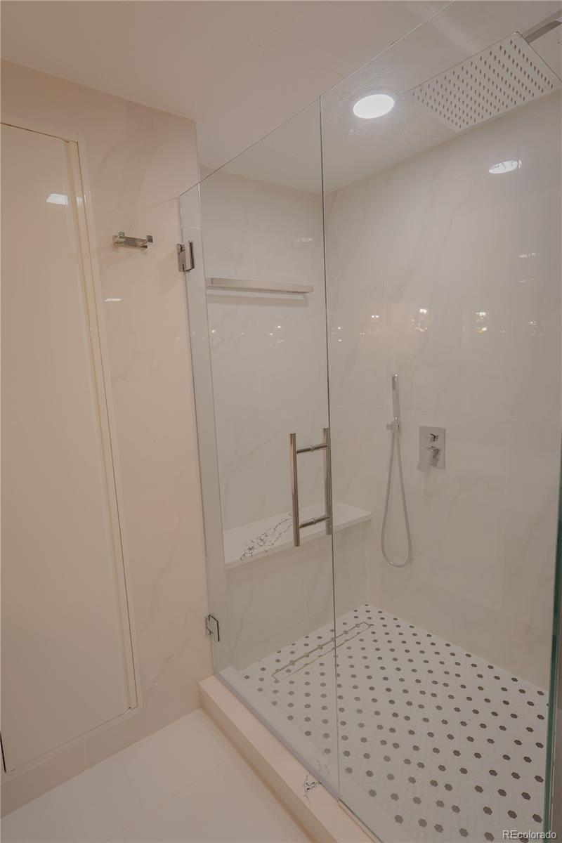 5661 West Lakeridge Road Denver, CO 80227 - Photo 39 of 48 a bathroom with a shower