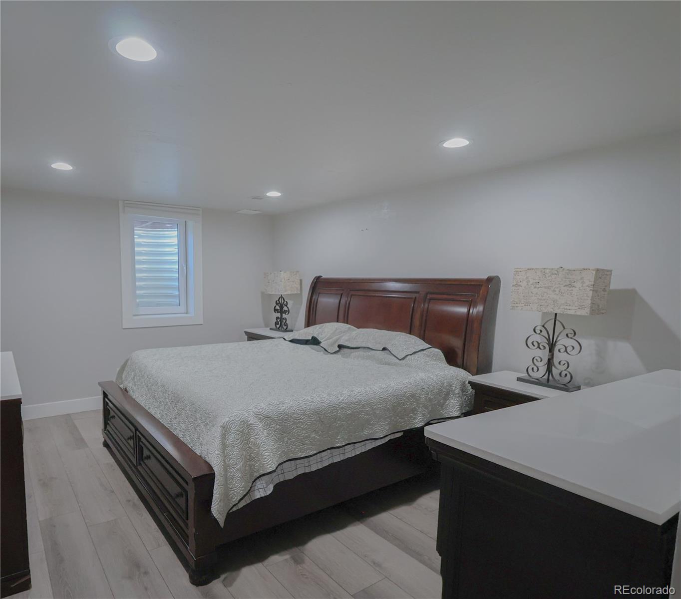 5661 West Lakeridge Road Denver, CO 80227 - Photo 40 of 48 a bedroom with bed and window