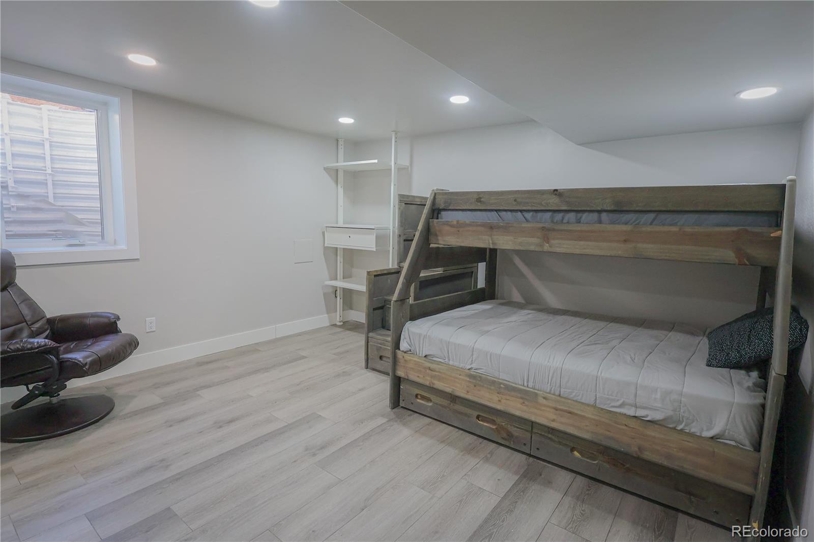 5661 West Lakeridge Road Denver, CO 80227 - Photo 43 of 48 a bedroom with a bed and a window