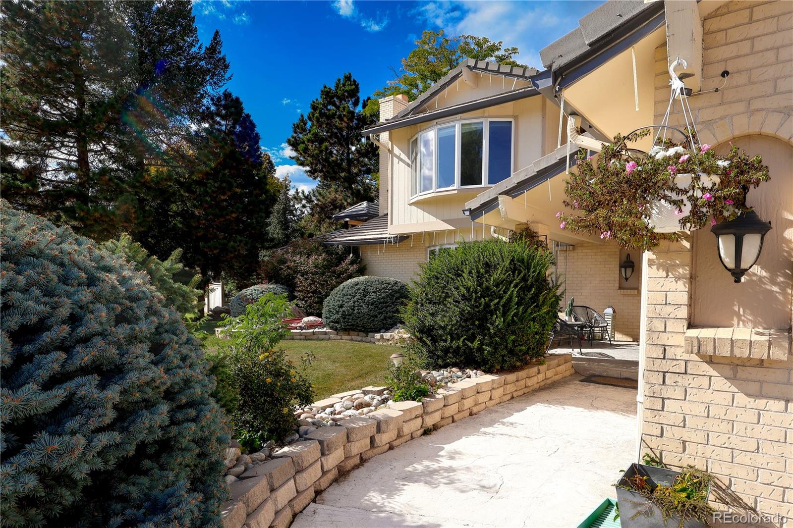 5661 West Lakeridge Road Denver, CO 80227 - Photo 45 of 48 a front view of a house with a yard
