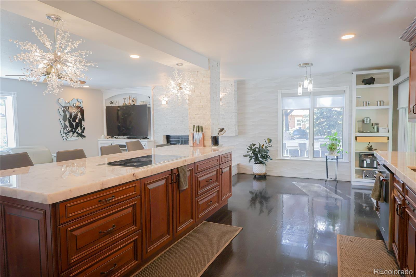 5661 West Lakeridge Road Denver, CO 80227 - Photo 10 of 48 a view of living room kitchen with a sink and dishwasher