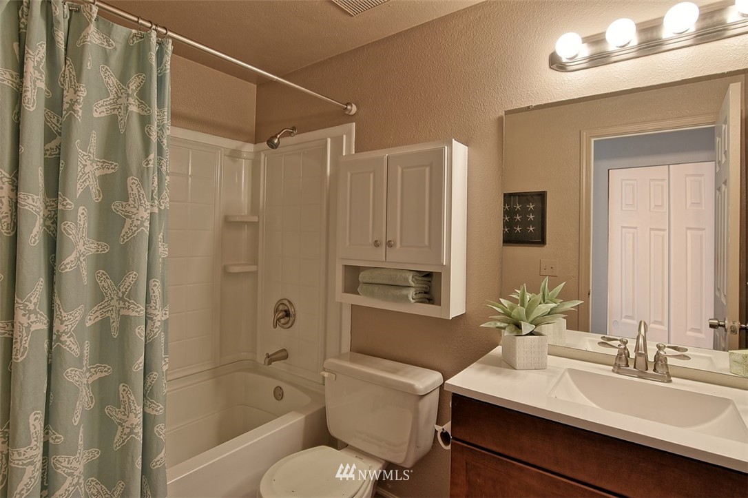 2417 171st Street Southeast Bothell, WA 98012 - Photo 13 of 18 a bathroom with a sink toilet tub and shower